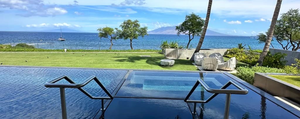 Infinity pool with stainless steel railings and ocean views, Maui